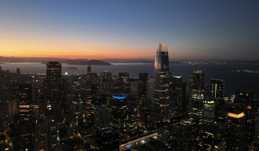 Twilight skyline of a global financial hub, illustrating where ultra-high-net-worth wealth is concentrating in 2026