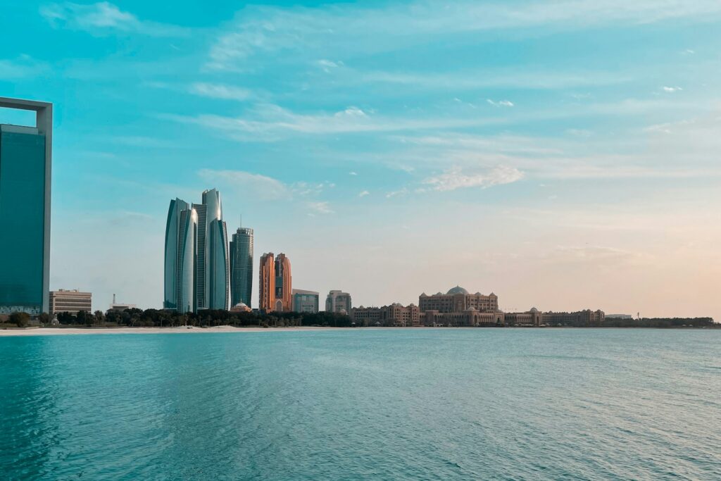 Towers of the Abu Dhabi financial district on the waterfront at dusk