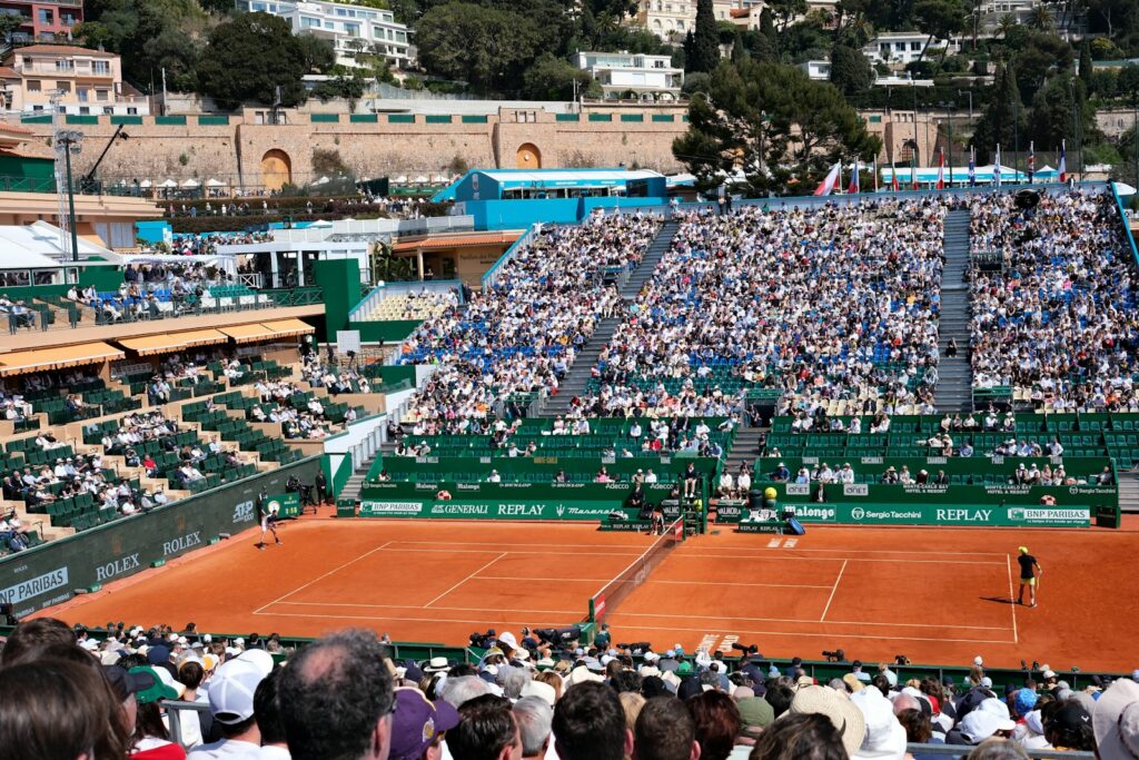 Full grandstands around the court during a professional tennis championship match