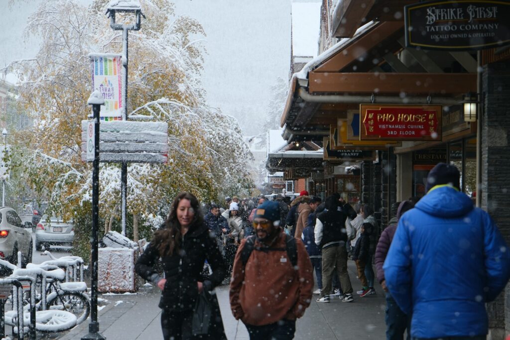 People walking a snowy street during festival week — Perfect.Live