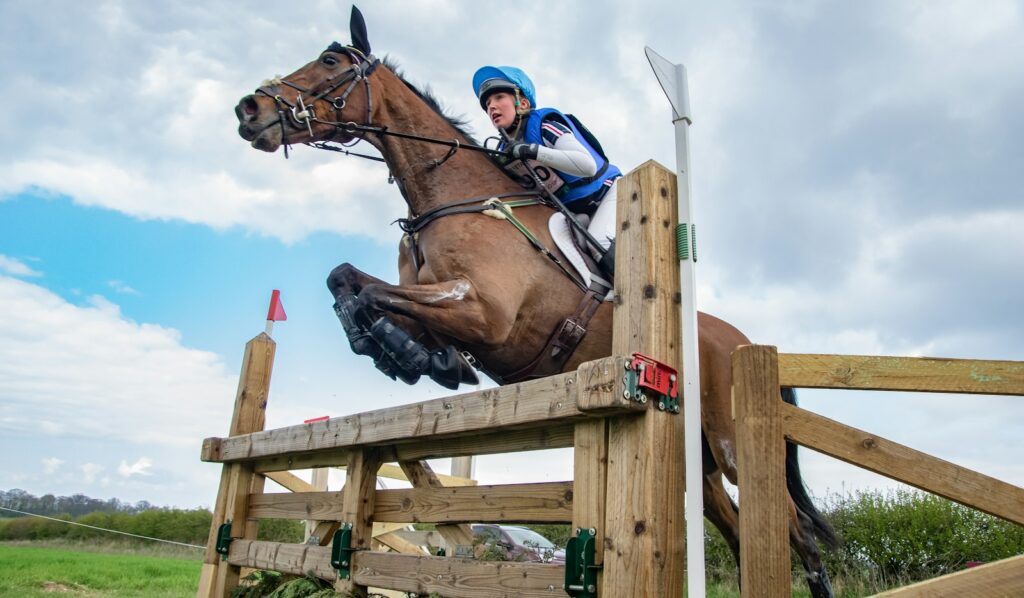 A horse and rider jumping a cross-country fence, the discipline that decides the Burghley Horse Trials
