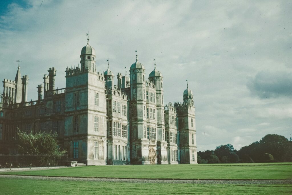 The Elizabethan facade of a great English country house set in parkland