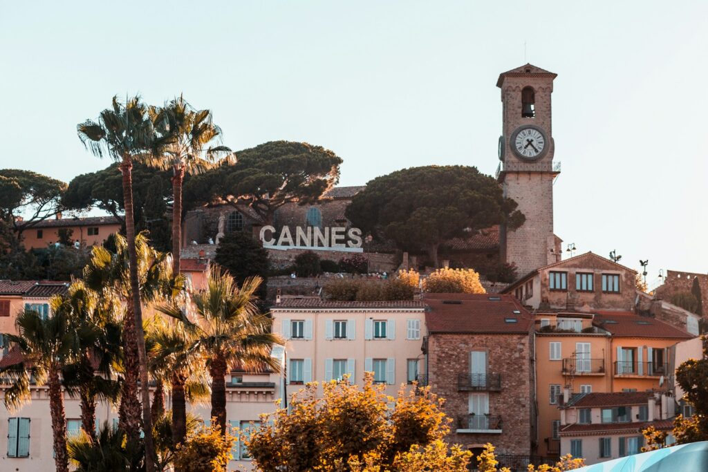 Clock tower and waterfront building marking Cannes on the French Riviera
