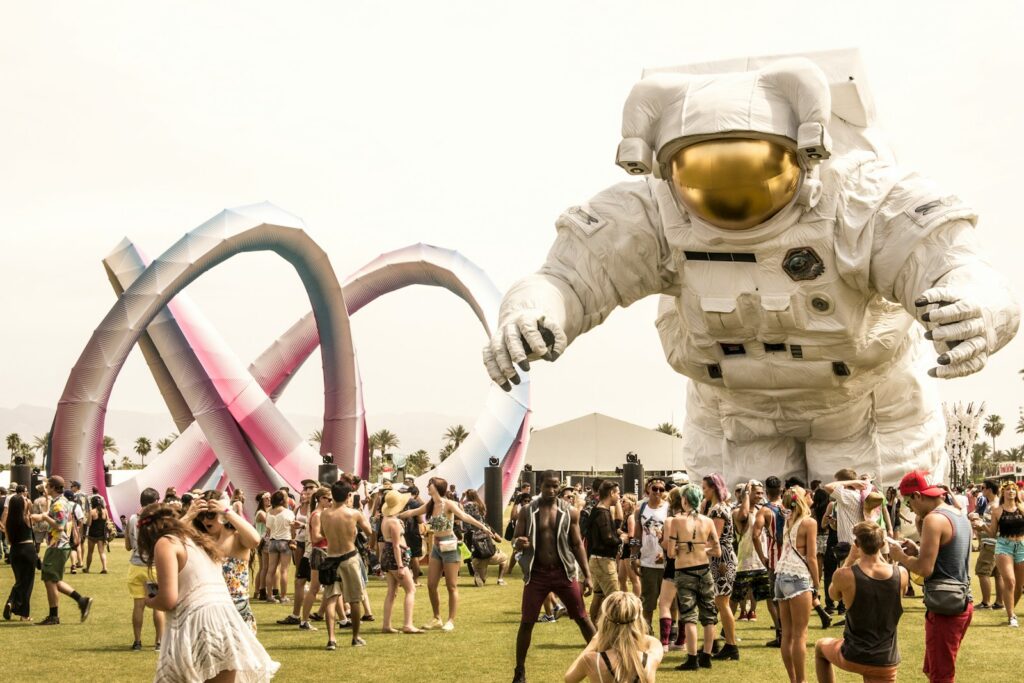 Crowd gathered around a large-scale art installation on the festival grounds at Coachella