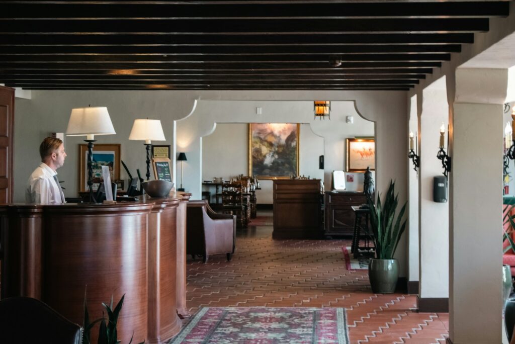 A hotel concierge desk with staff on hand, the external network a concierge coordinates