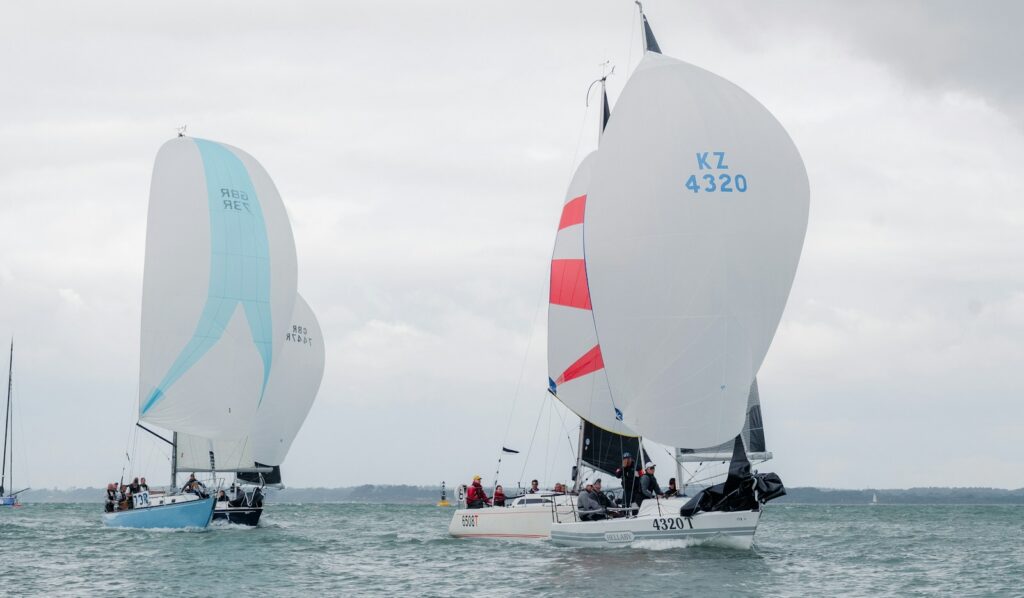 Boats with spinnakers set returning to port during Cowes Week on the Isle of Wight