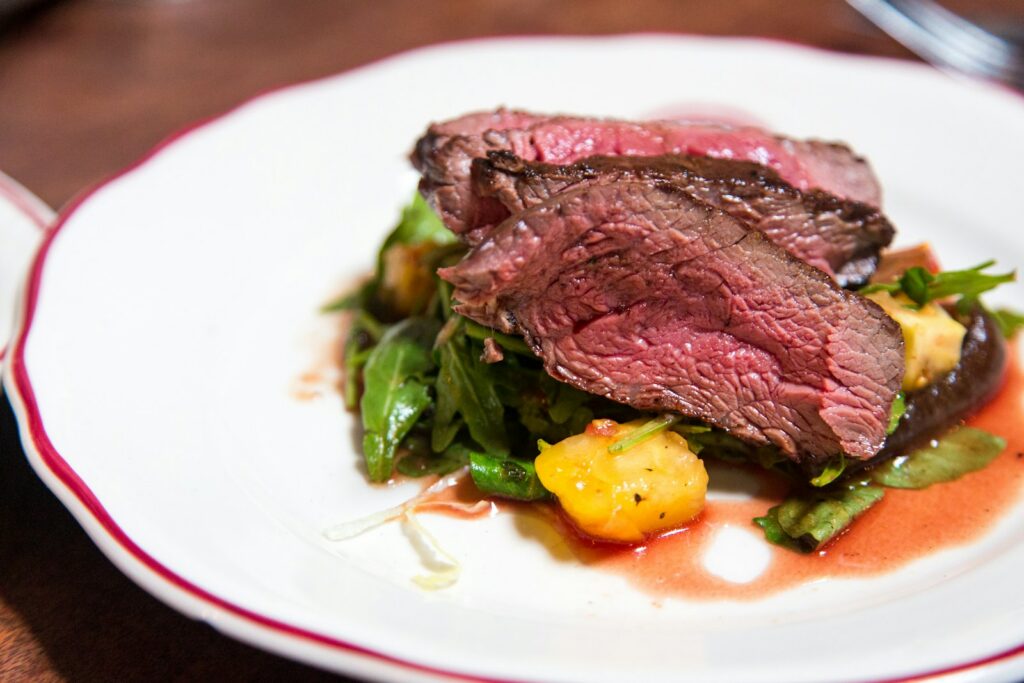 A dry-aged steak plated at one of London’s best steakhouses