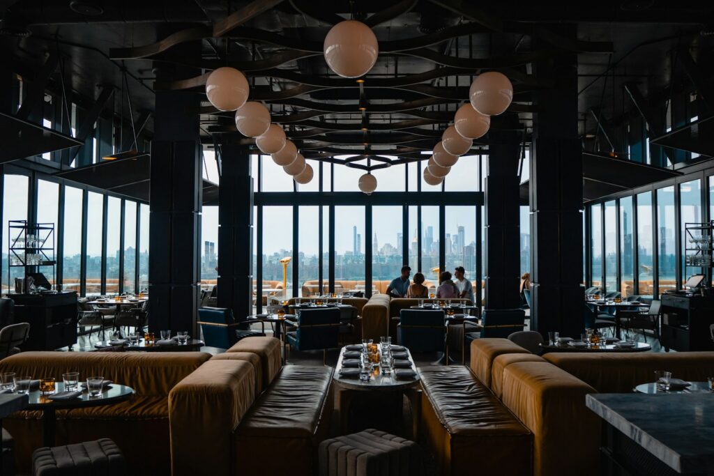 A dining room set for a business dinner, where the room does as much work as the menu
