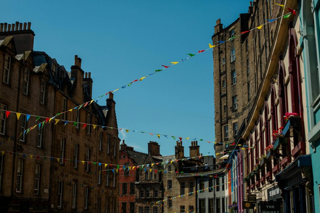 Colourful bunting strung across a street in Edinburgh's Grassmarket