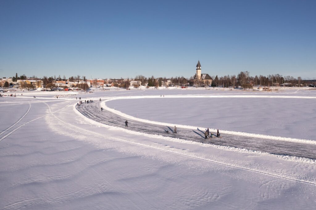 Frozen lake and village in the Engadin valley in winter