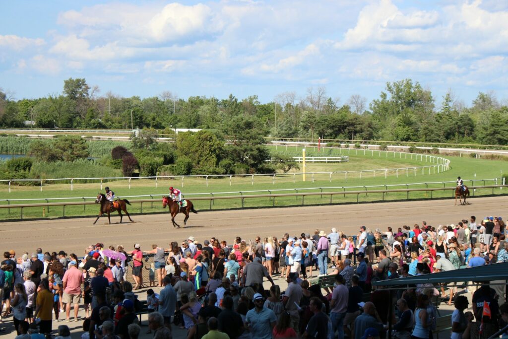 Crowd watching the racing from the Hill on Epsom Derby Day