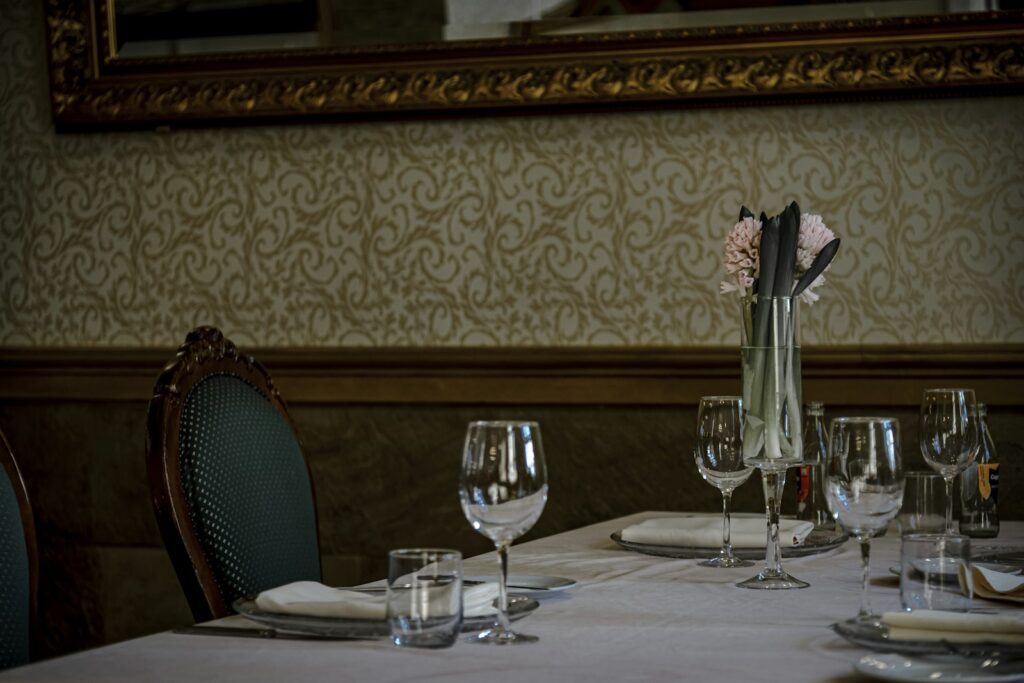 A formal table laid for service, in a city where dining supply tightens sharply during Watches and Wonders