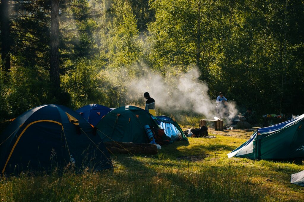 Tents across a festival campsite in a Somerset field — Perfect.Live
