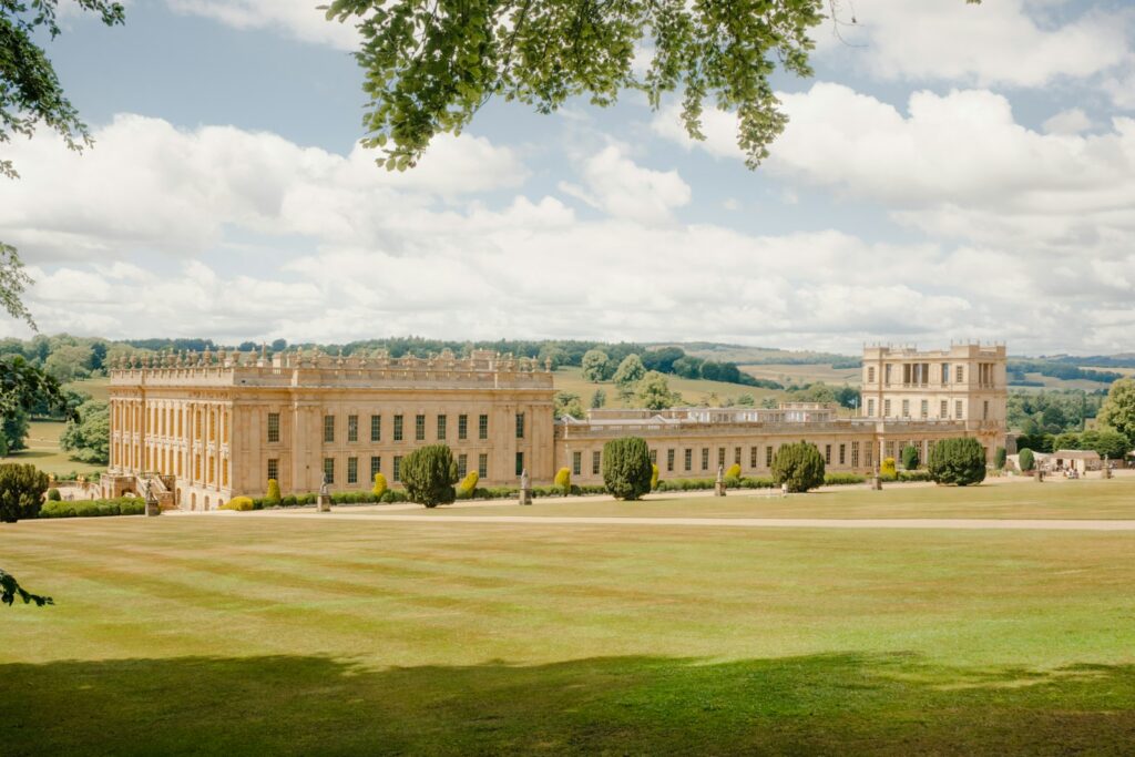 An English country house seen across its parkland on a downland estate
