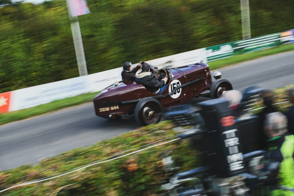 A vintage single-seater racing car at speed on a circuit