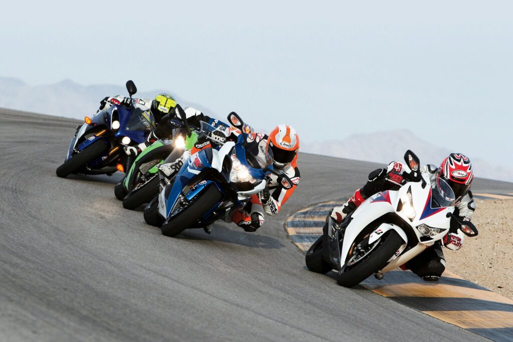 Motorcycles leaned through a corner during a race