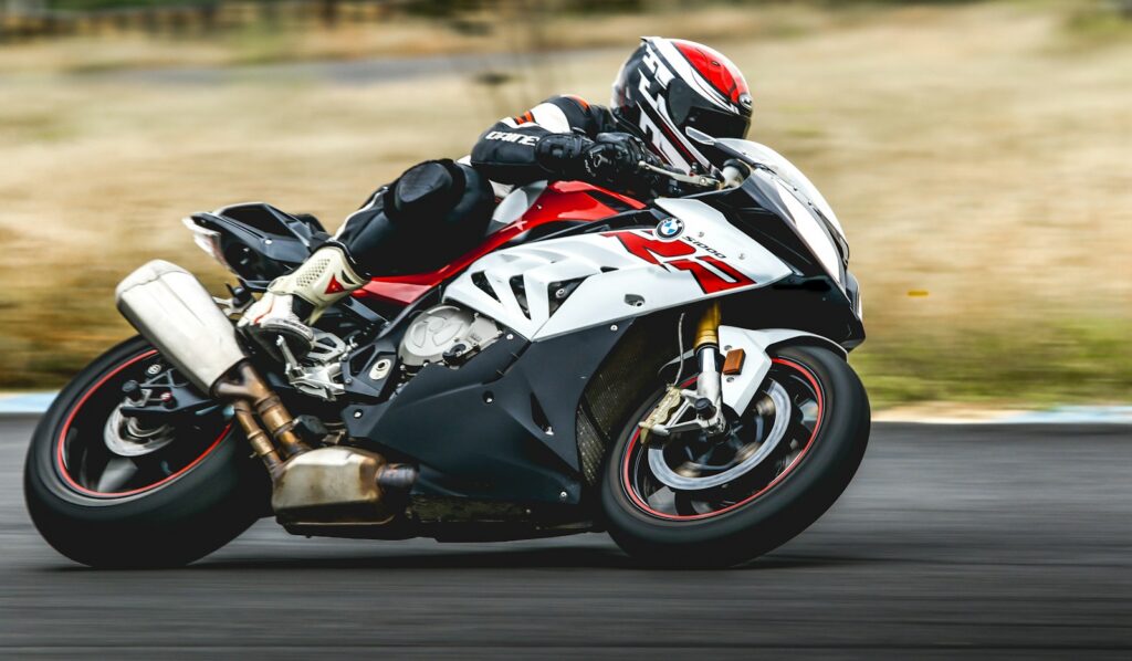Motorcycle at speed and leaned over on an open road, as raced at the Isle of Man TT
