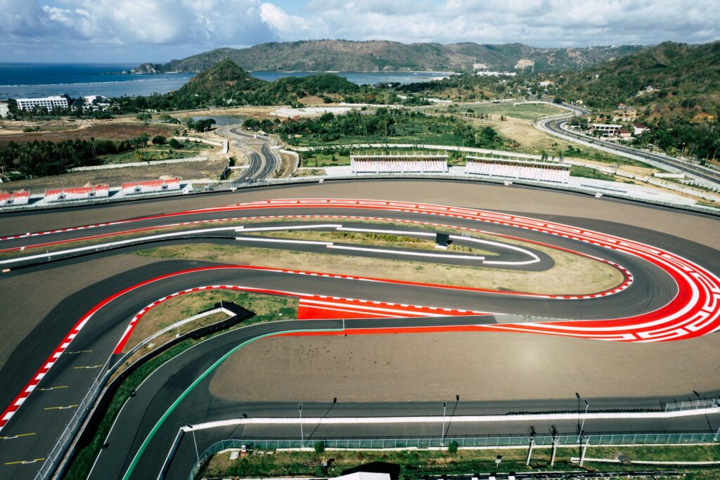 Aerial view of a road-racing circuit with a long sweeping corner