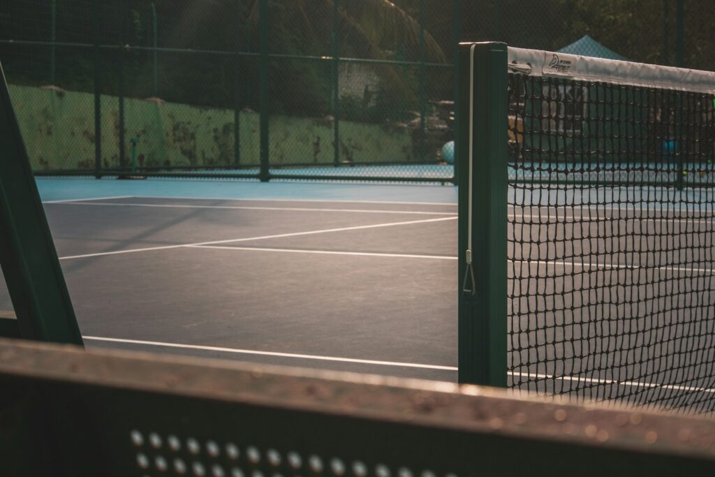 Two tennis players on court during a match