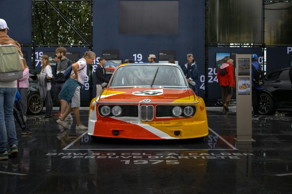 Vintage BMW 3.0 CSL race car on display in the Le Mans paddock