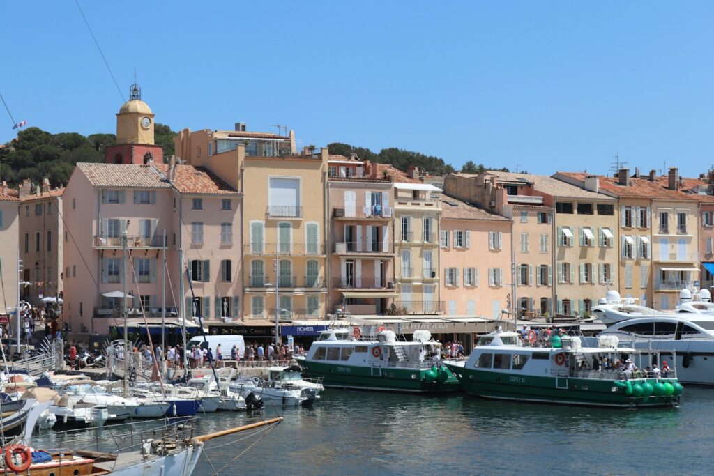 The harbour front of Saint-Tropez with its coloured houses and moored boats