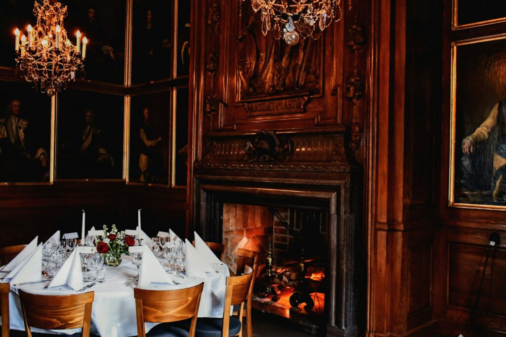 A wood-panelled London grill room laid for dinner, the kind of table our concierge team secures on short notice