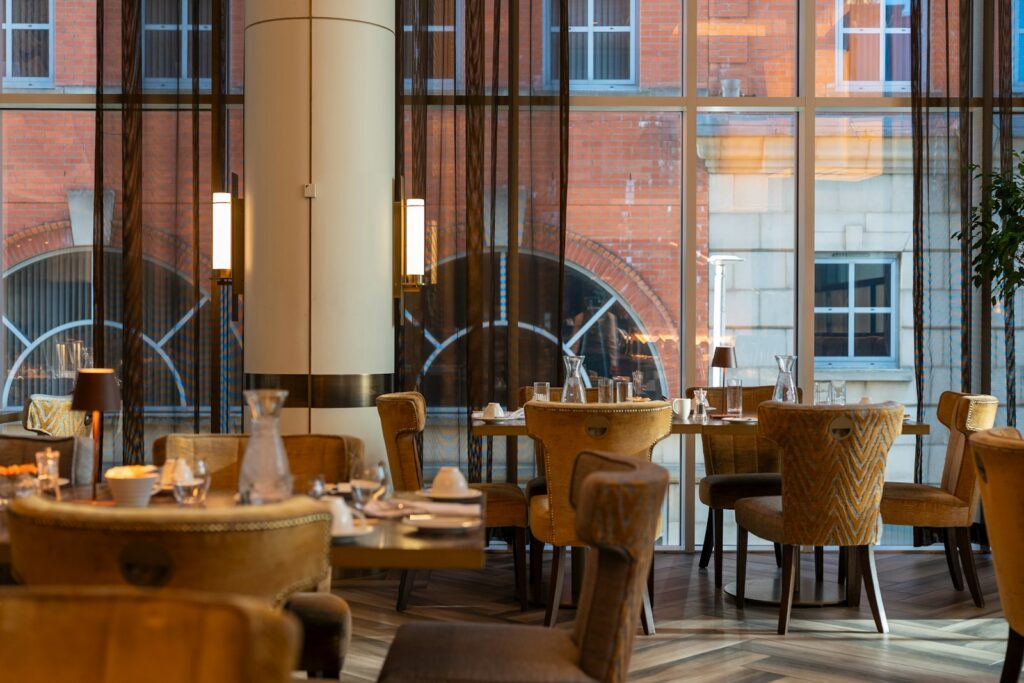 An empty dining room at a Michelin-star restaurant in London, laid before service