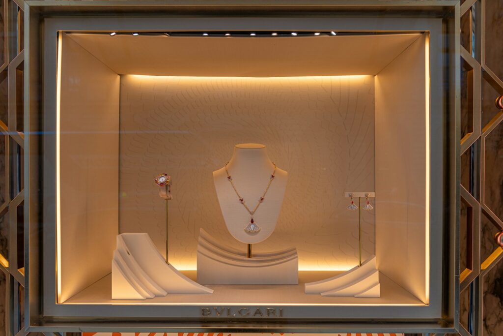 Lit jewellery display in a Mayfair boutique window, London