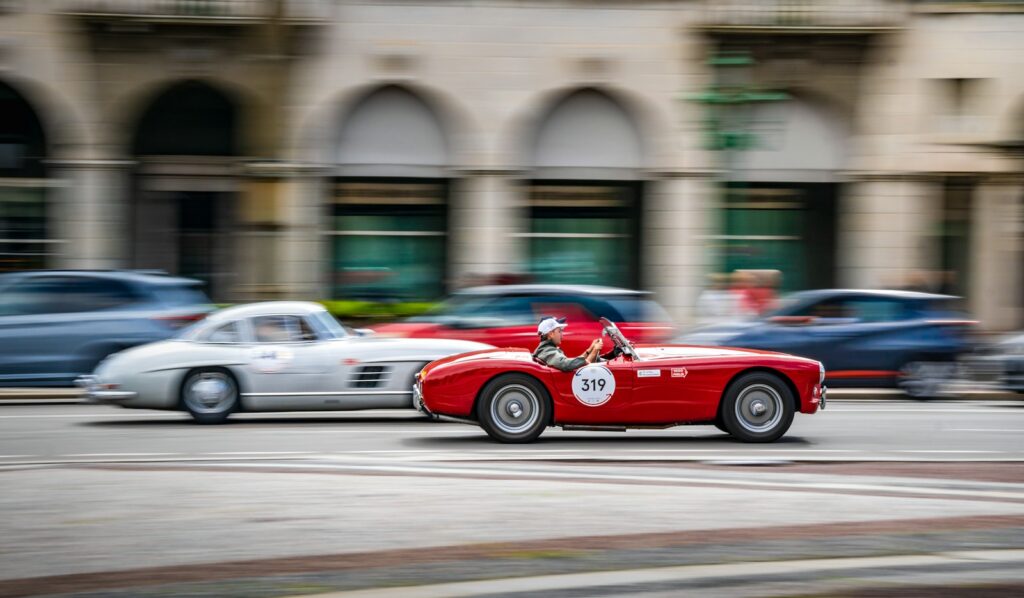 Pre-war sports car on a Tuscan road during the Mille Miglia