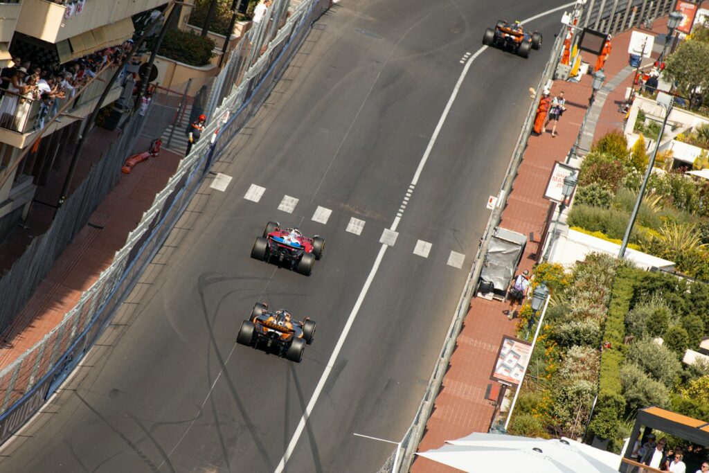 Cars racing along the harbour front in Monaco — Perfect.Live