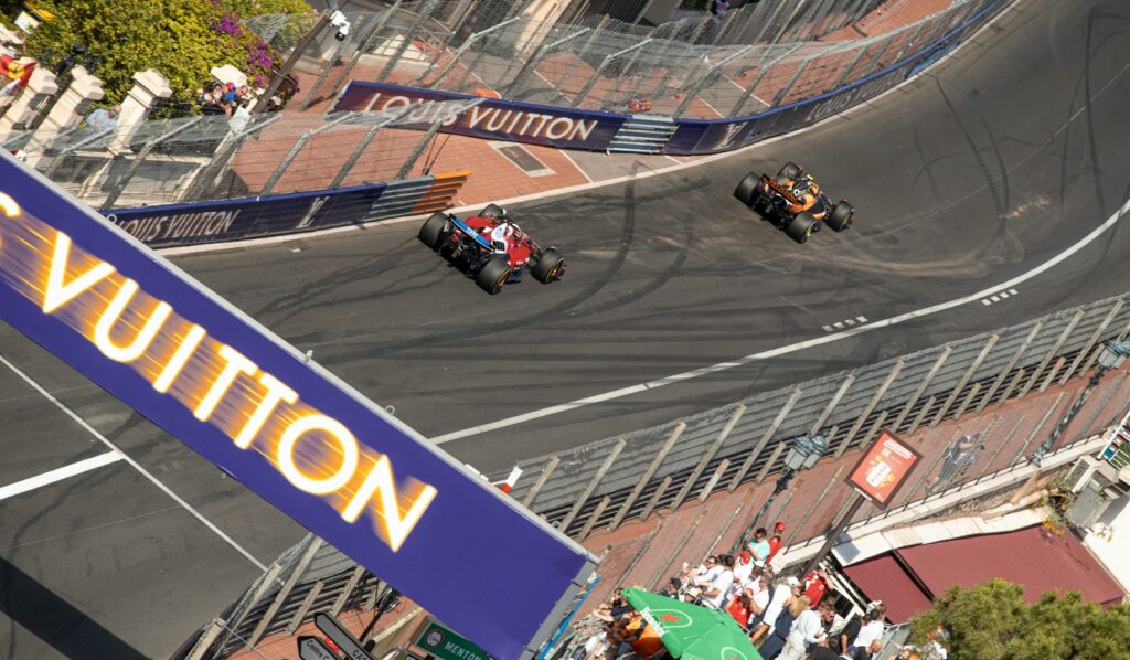 Historic Formula One car cornering on the Monaco street circuit during the Monaco Historique Grand Prix