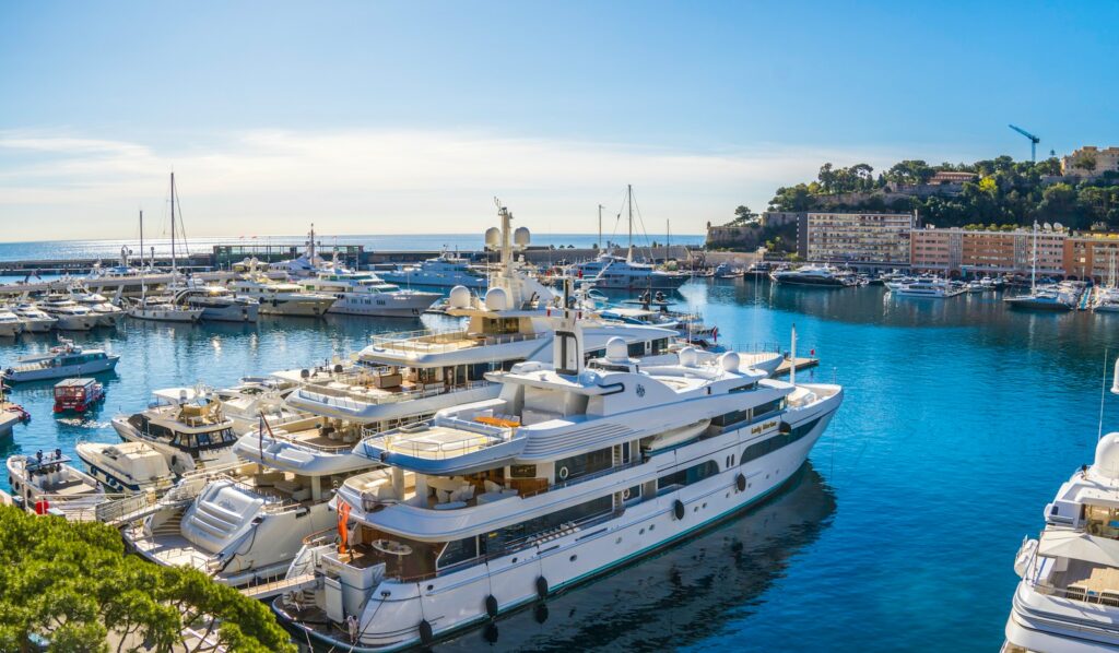 Superyachts moored side by side in Port Hercule during the Monaco Yacht Show — Perfect.Live
