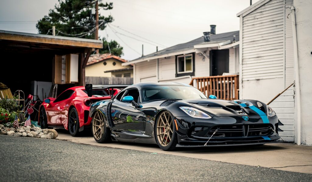 Modified performance cars parked on a residential street during Monterey Car Week
