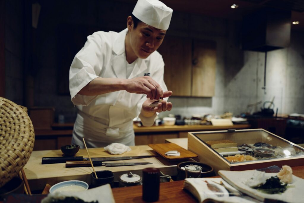 An omakase counter, where the handful of seats vanish the moment the calendar opens