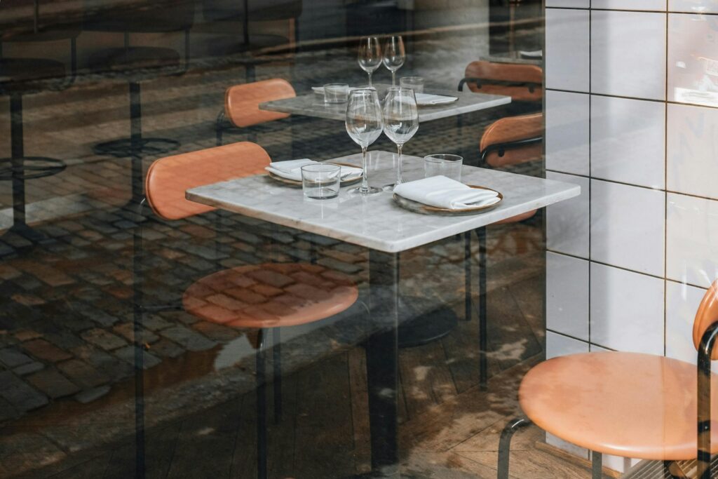 A modern counter laid for a tasting menu, the opposite register to the grand dining rooms
