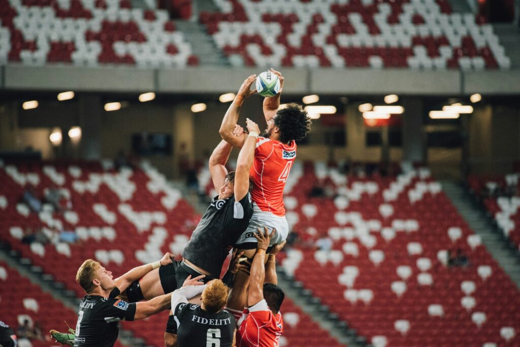 Players contesting possession during a rugby match — Perfect.Live