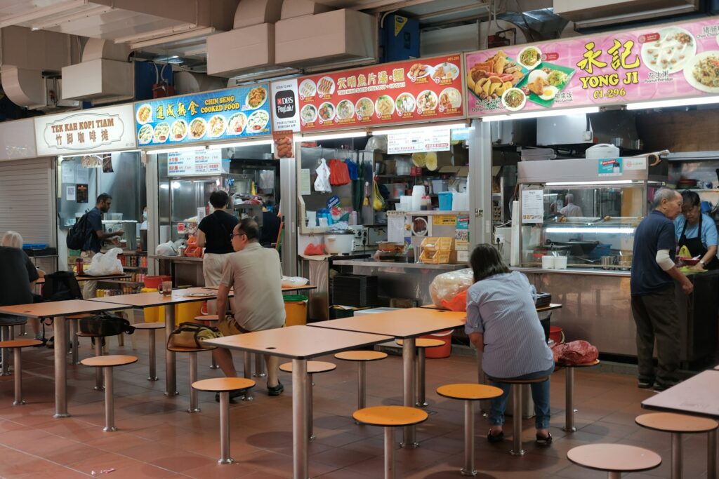 A Singapore hawker centre, where a stall and a tasting-menu restaurant sit in the same Michelin selection