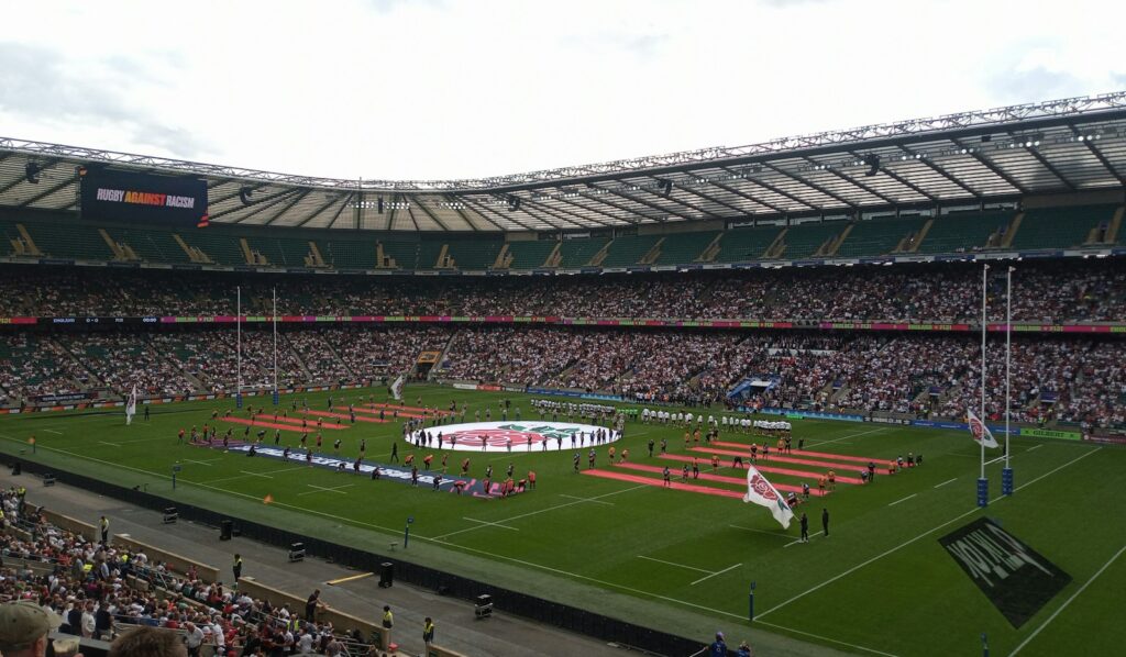 Packed rugby stadium under floodlights during a Six Nations match — Perfect.Live