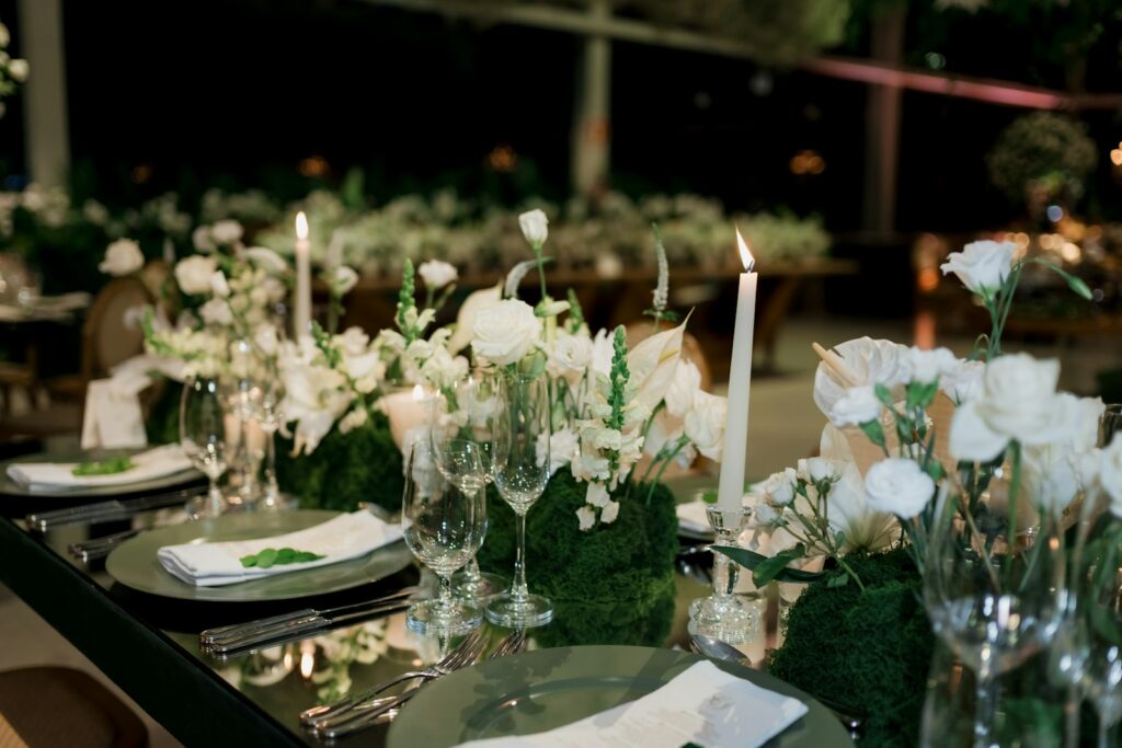 A table dressed with flowers and candles for a special-occasion dinner, the set-up that books out first on peak dates