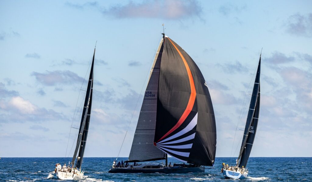 Racing yachts under spinnaker sailing in close company on the open ocean