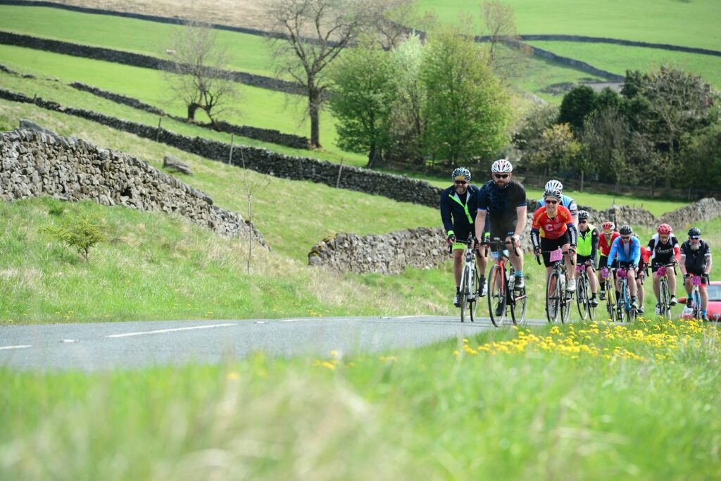 Riders on the road during a Tour de France stage — Perfect.Live