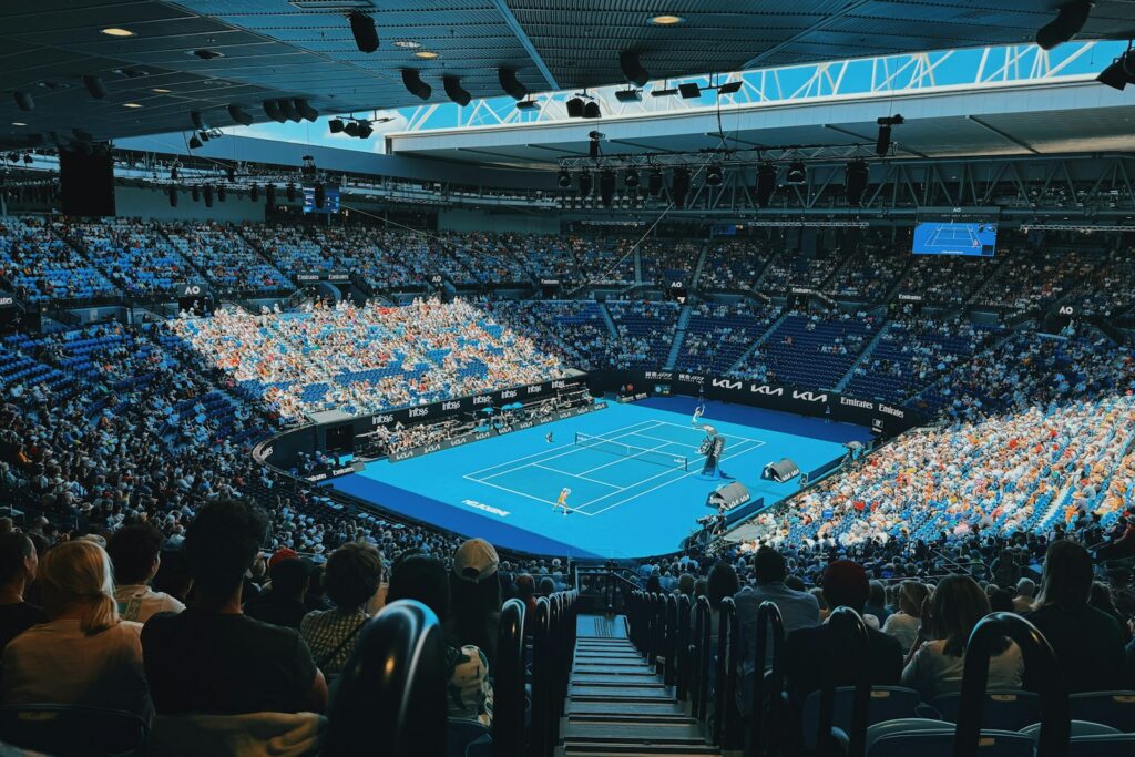 Crowded stadium with a match in progress — Perfect.Live