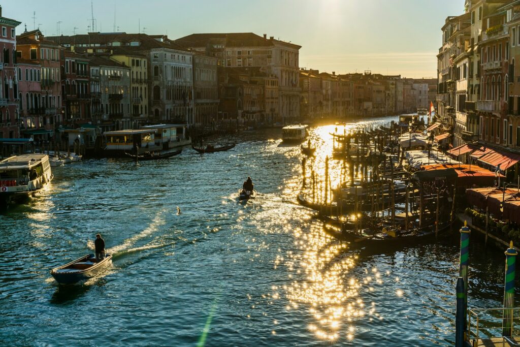 The Grand Canal in Venice at sunset, lined with historic buildings