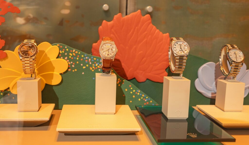 Watches on display plinths at a watchmaking brand stand at Watches and Wonders Geneva
