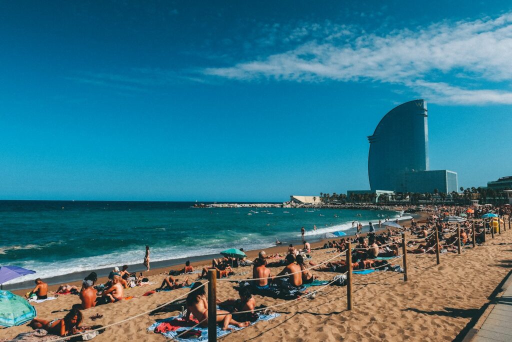 La Barceloneta beach in Barcelona with the W Barcelona hotel in the distance