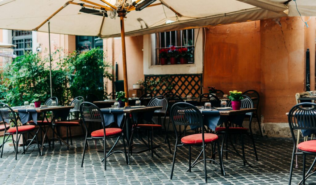 Terrace tables on a cobbled Roman square, a setting among the best restaurants in Rome