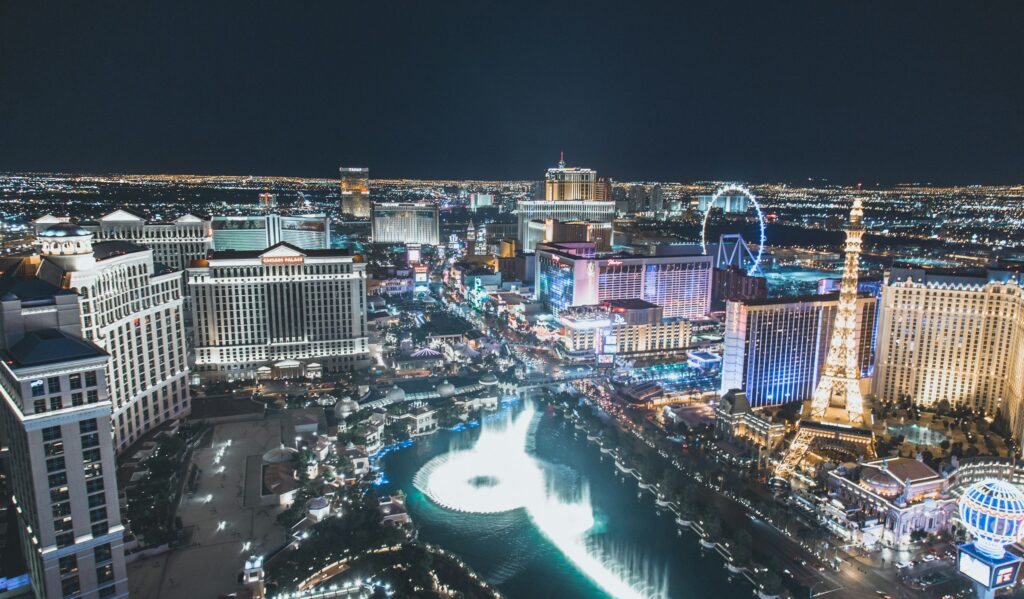 The Las Vegas Strip at night with the Bellagio fountains, where the best restaurants in Las Vegas sit inside the resorts