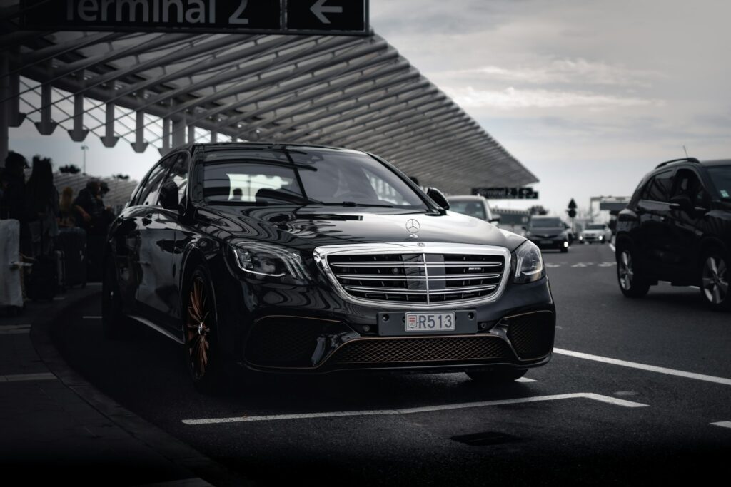 Chauffeured car waiting at a terminal for an executive transfer
