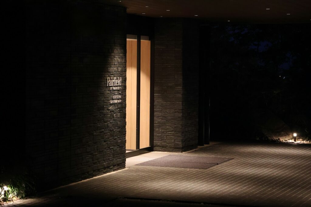 Discreet building entrance with warm lighting at night