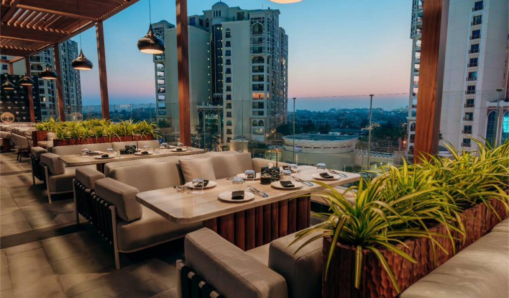 Chalet Berezka Dubai rooftop terrace at dusk on the West Rooftop of Nakheel Mall